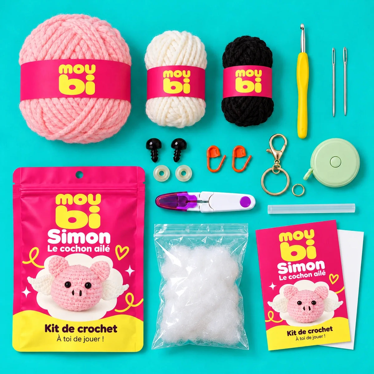 Contenu du kit de crochet Simon, le cochon ailé : fils, crochet, accessoires, sachet et livret Moubi.